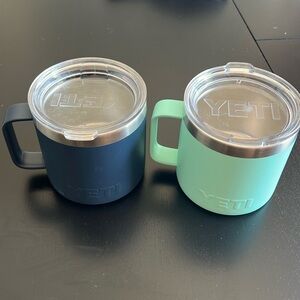 Two yeti coffee tumblers